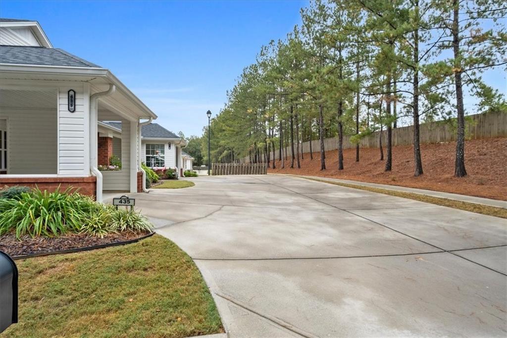 150 Old Mill Road, Unit 435 Cartersville, GA 30120 - Photo 4 of 22 a swimming pool with yard and trees in the background