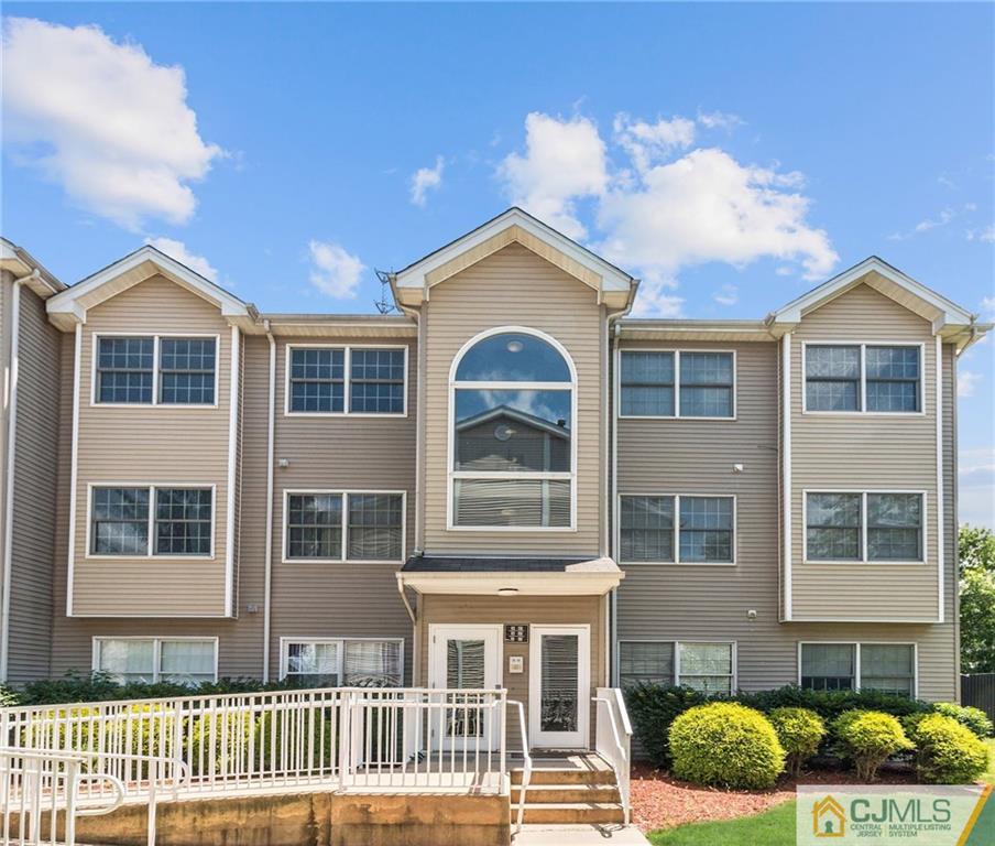 1131 Edpas Road, Unit 1131 New Brunswick, NJ 08901 - Photo 2 of 20 a front view of a house with a yard