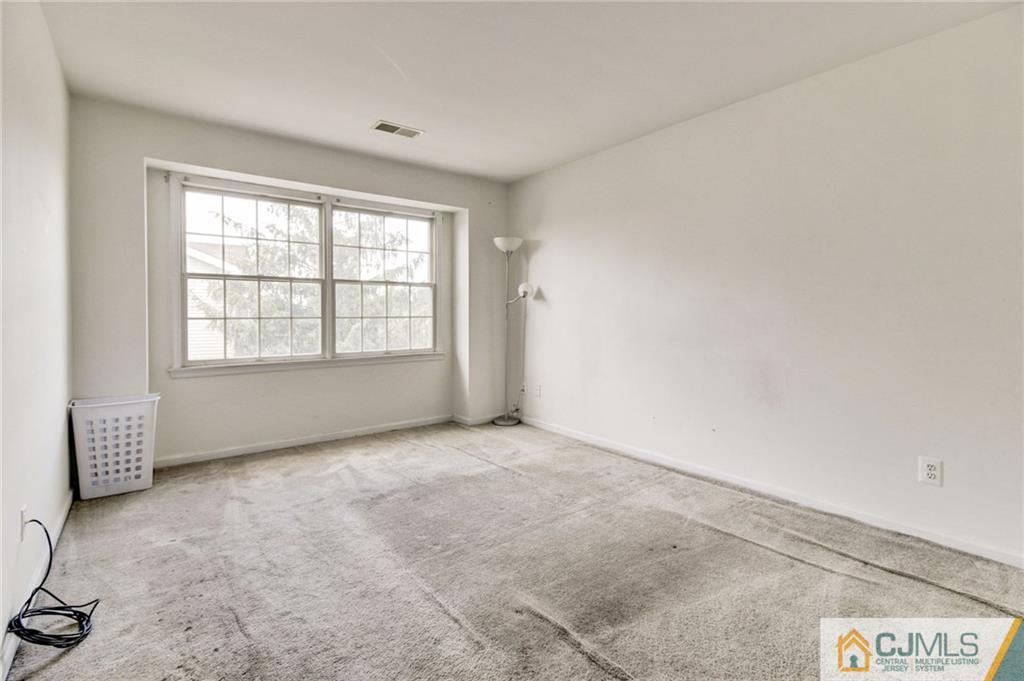 1131 Edpas Road, Unit 1131 New Brunswick, NJ 08901 - Photo 11 of 20 a view of an empty room with a window