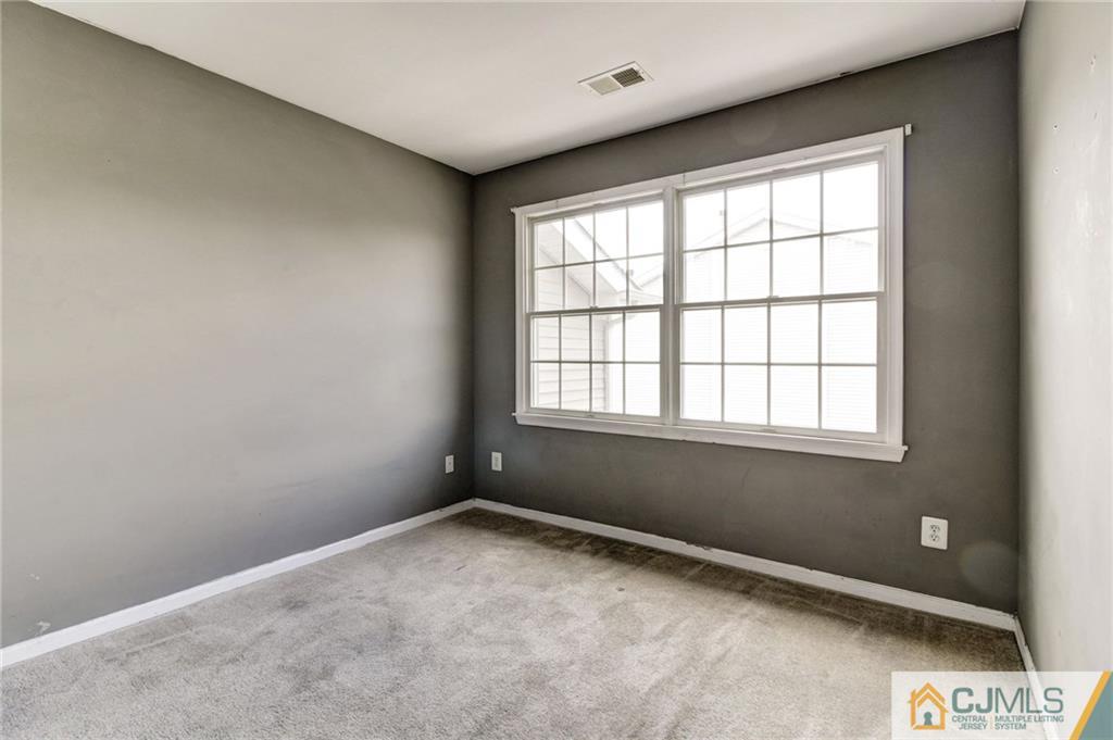 1131 Edpas Road, Unit 1131 New Brunswick, NJ 08901 - Photo 15 of 20 a view of an empty room with a window