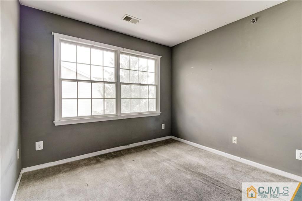 1131 Edpas Road, Unit 1131 New Brunswick, NJ 08901 - Photo 16 of 20 a view of an empty room with a window
