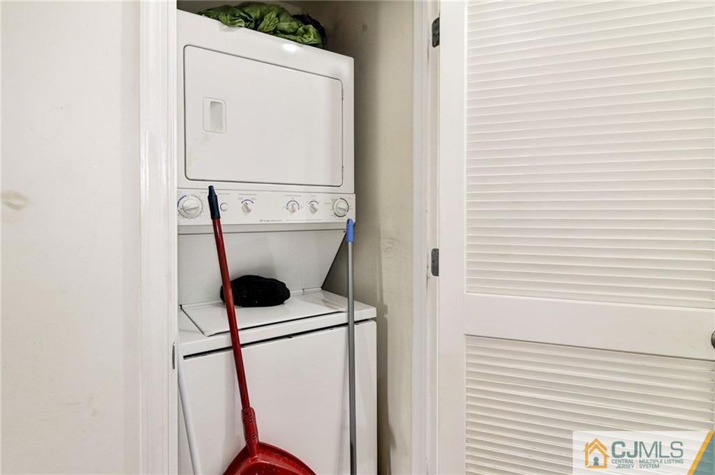 1131 Edpas Road, Unit 1131 New Brunswick, NJ 08901 - Photo 18 of 20 a close up of a washer and dryer