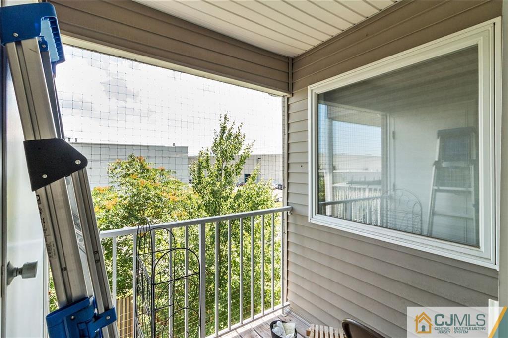 1131 Edpas Road, Unit 1131 New Brunswick, NJ 08901 - Photo 19 of 20 a view of a balcony with wooden floor