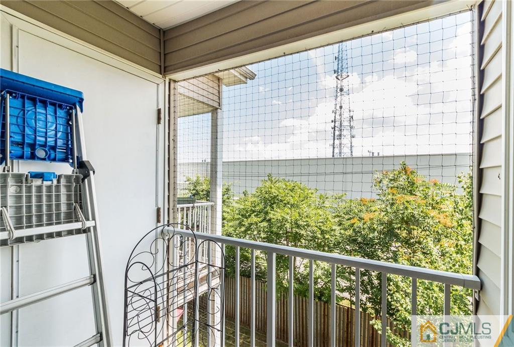 1131 Edpas Road, Unit 1131 New Brunswick, NJ 08901 - Photo 20 of 20 a view of a balcony with wooden floor