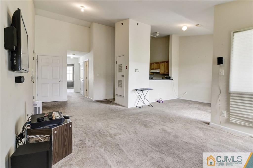 1131 Edpas Road, Unit 1131 New Brunswick, NJ 08901 - Photo 5 of 20 a kitchen with stainless steel appliances granite countertop a stove and a refrigerator