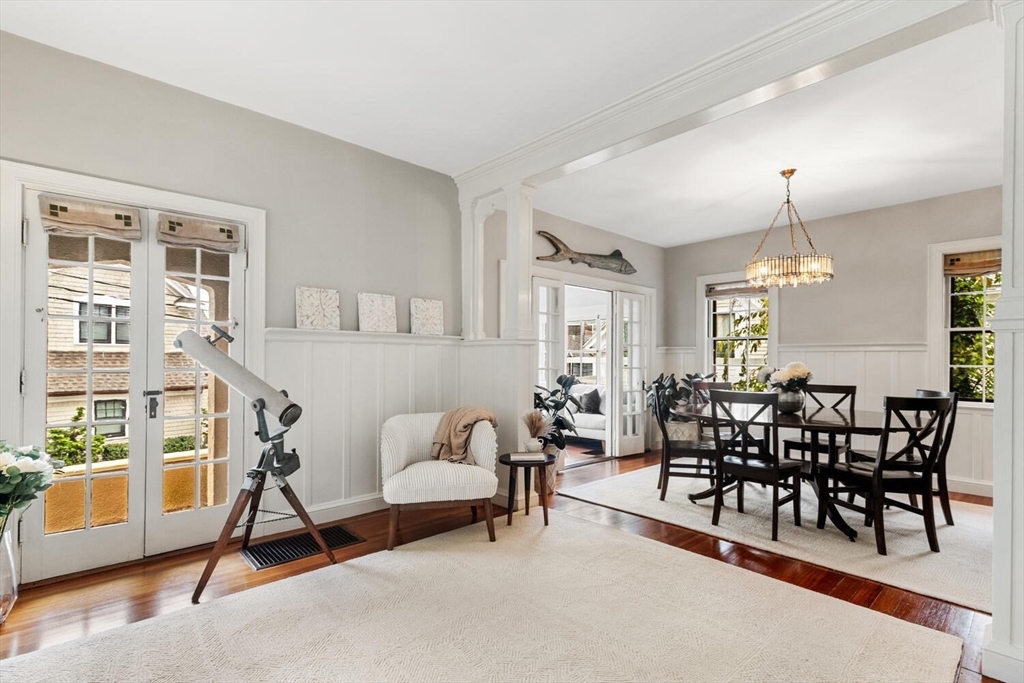 33 Waldron Street Marblehead, MA 01945 - Photo 11 of 42 a living room with furniture a dining table and a chandelier