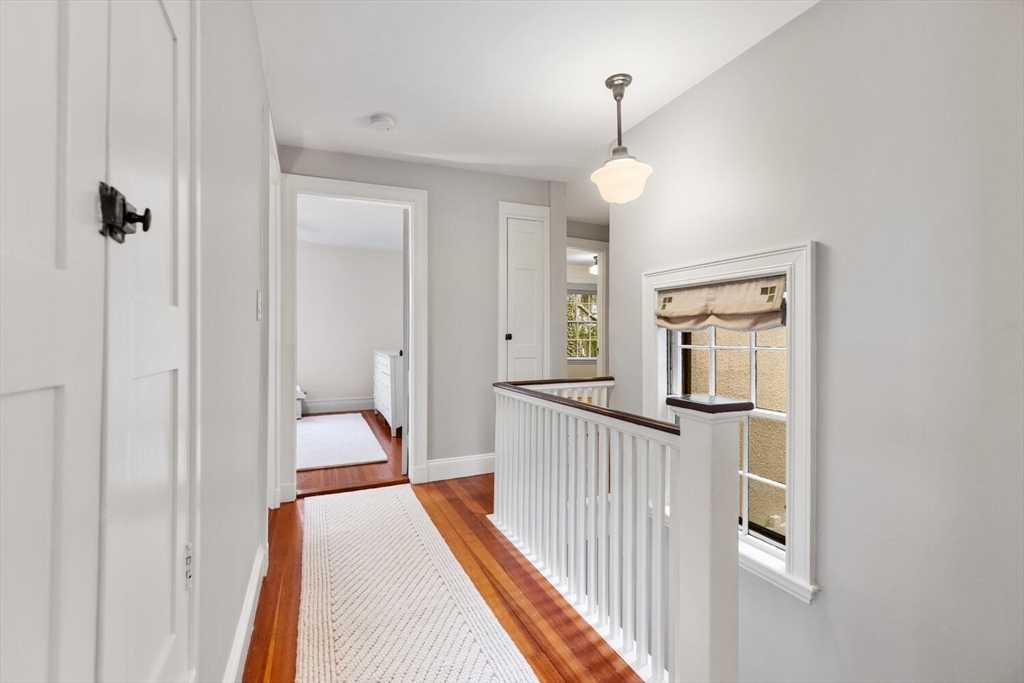 33 Waldron Street Marblehead, MA 01945 - Photo 20 of 42 a view of a hallway with a chandelier
