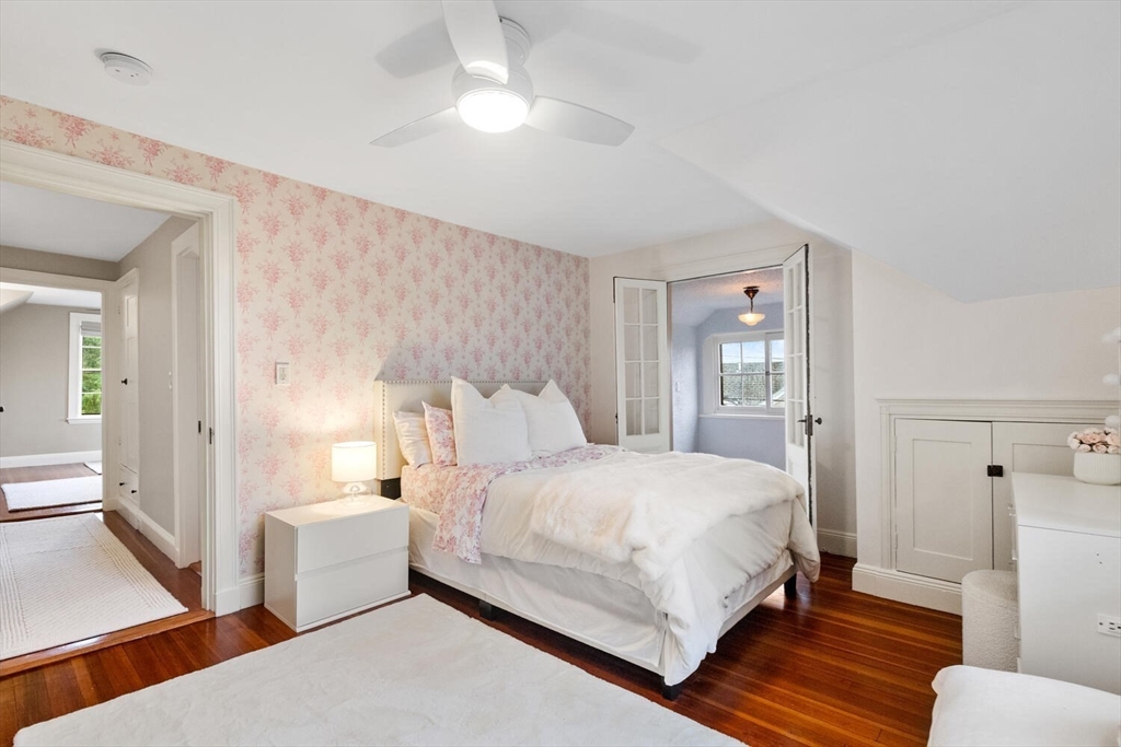 33 Waldron Street Marblehead, MA 01945 - Photo 23 of 42 a bedroom with a bed and a lamp