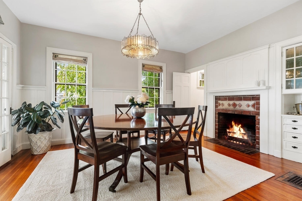 33 Waldron Street Marblehead, MA 01945 - Photo 9 of 42 a dining room with furniture a chandelier and wooden floor