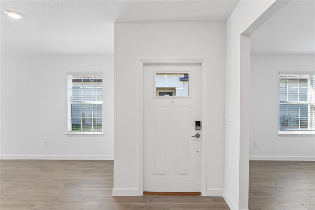 6692 Homebound Way New Port Richey, FL 34653 - Photo 5 of 47 an empty room with windows