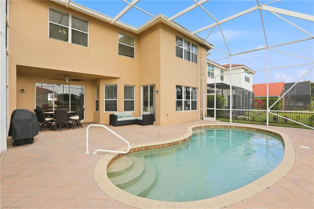 2150 Khasia Point Naples, FL 34119 - Photo 27 of 42 a view of a swimming pool with a lounge chairs