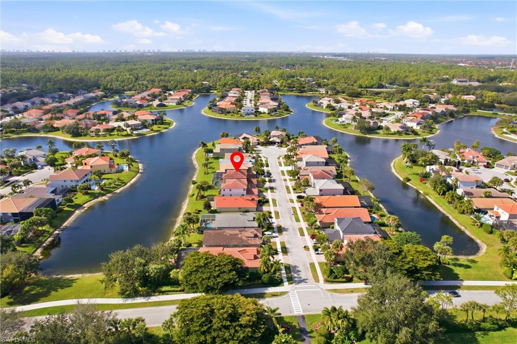 2150 Khasia Point Naples, FL 34119 - Photo 30 of 42 an aerial view of a city with lots of residential buildings ocean and mountain view in back