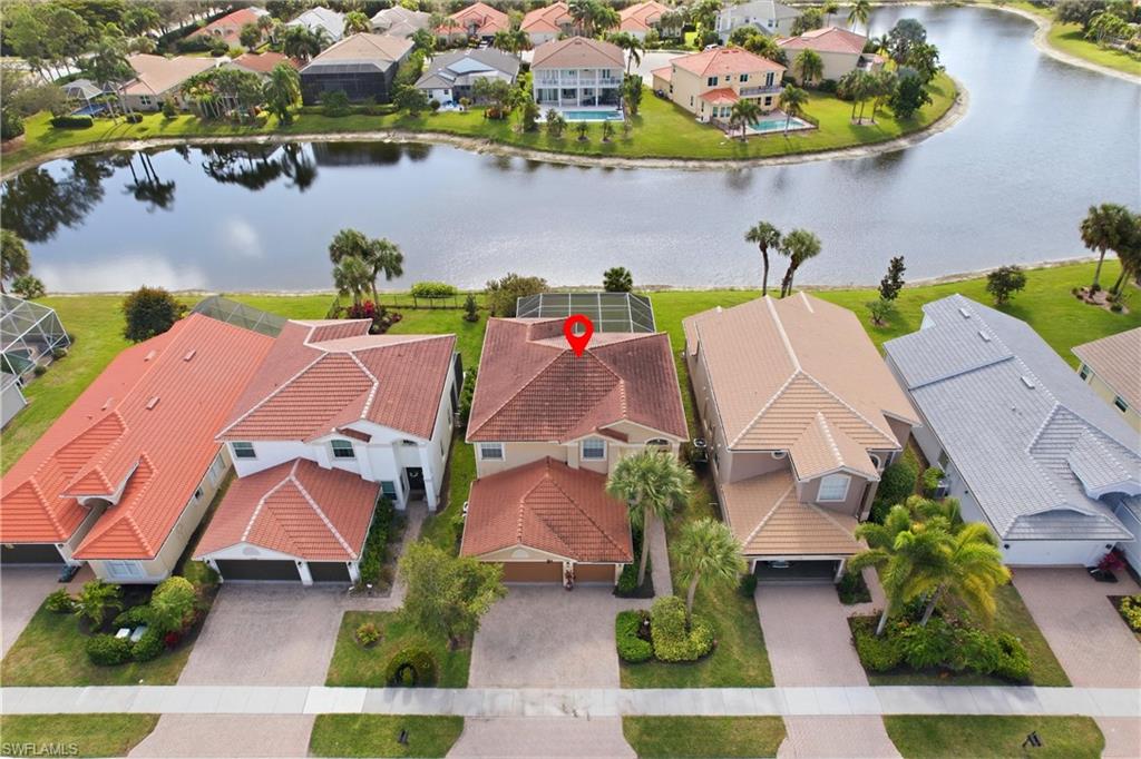 2150 Khasia Point Naples, FL 34119 - Photo 35 of 42 an aerial view of a house with a swimming pool yard and outdoor seating
