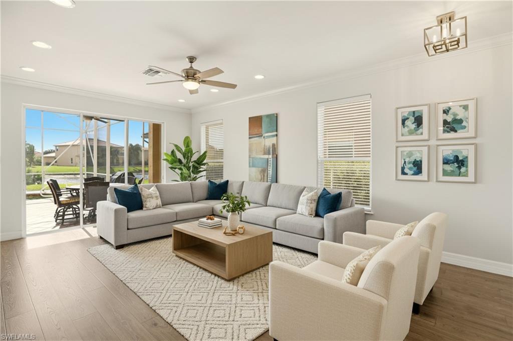 2150 Khasia Point Naples, FL 34119 - Photo 4 of 42 a living room with furniture and a large window