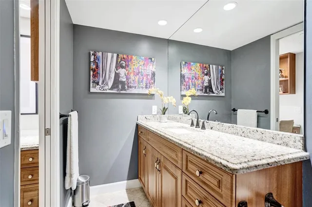a bath room with a sink and a mirror