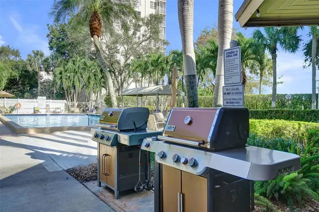 a view of a patio with a table and chairs