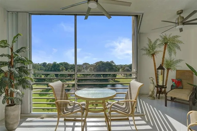 a view of a balcony with chairs and a table
