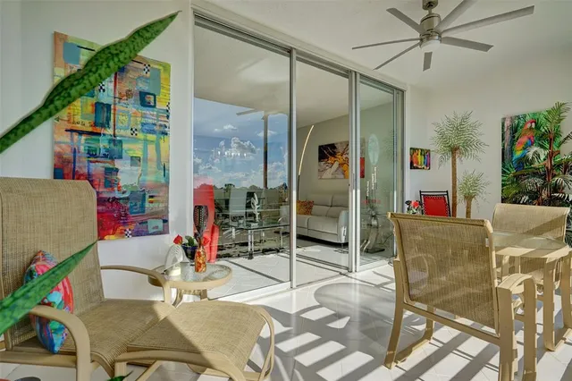 a living room with dining table and chairs