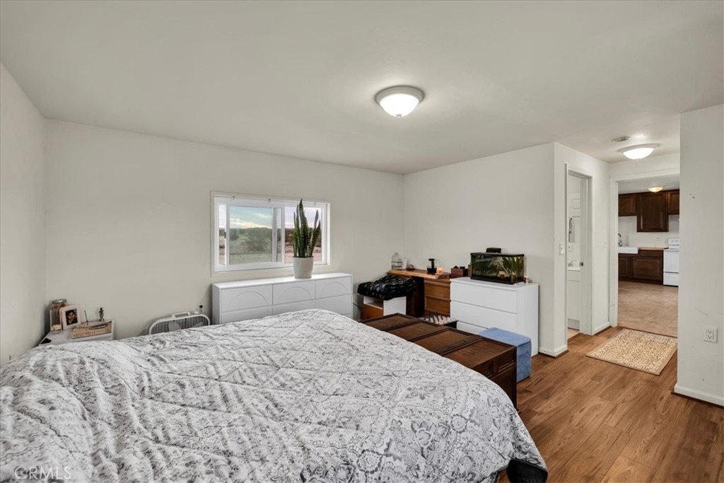 67550 Del Oro Road Twentynine Palms, CA 92277 - Photo 14 of 41 a bedroom with a bed and a large window