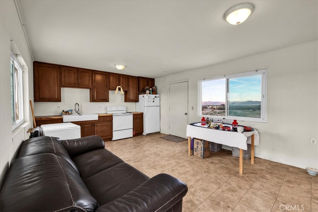 67550 Del Oro Road Twentynine Palms, CA 92277 - Photo 5 of 41 a living room with furniture and a wooden floor