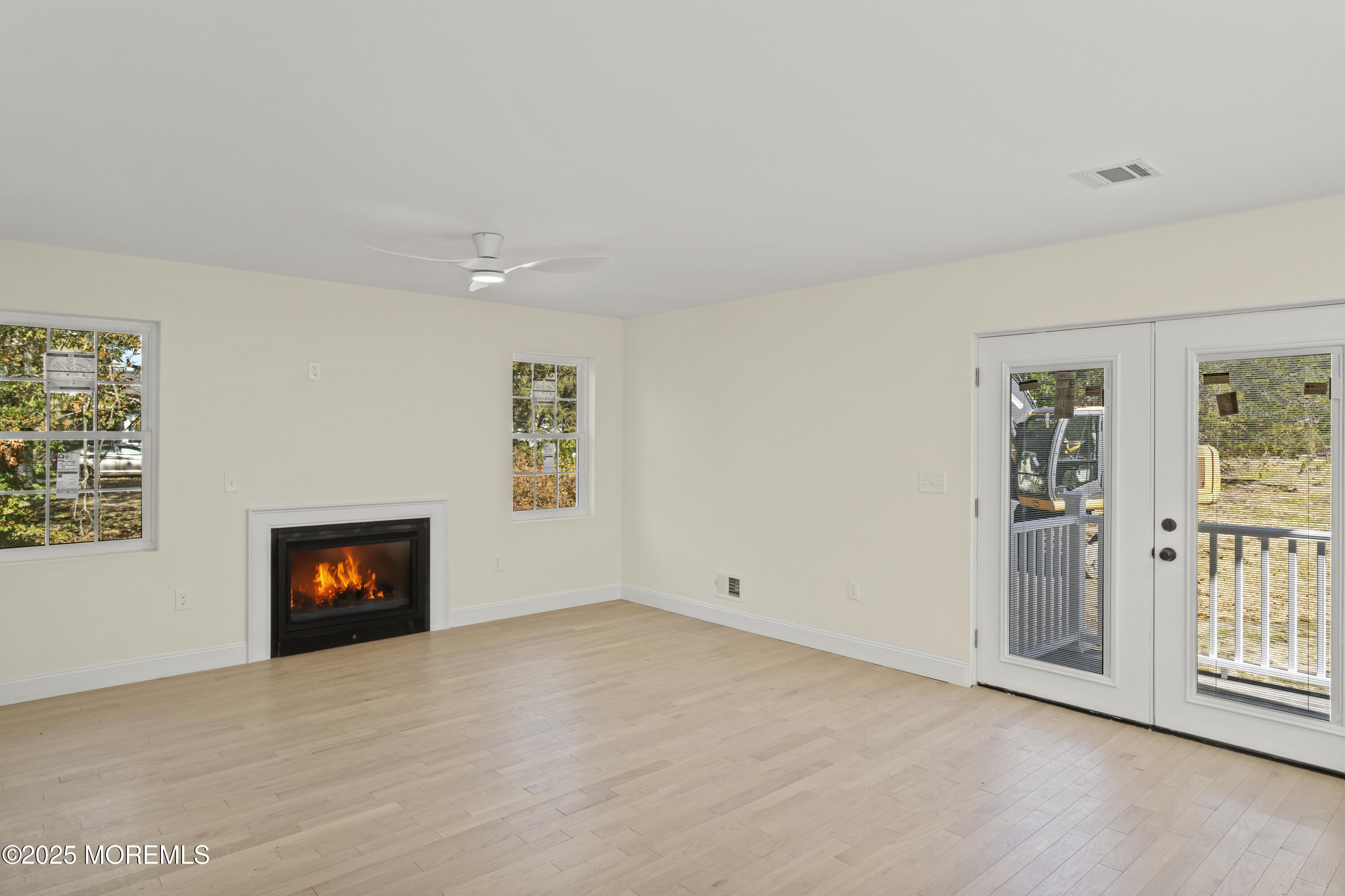 636 Wayside Road Neptune Township, NJ 07753 - Photo 8 of 26 an empty room with windows and cabinet