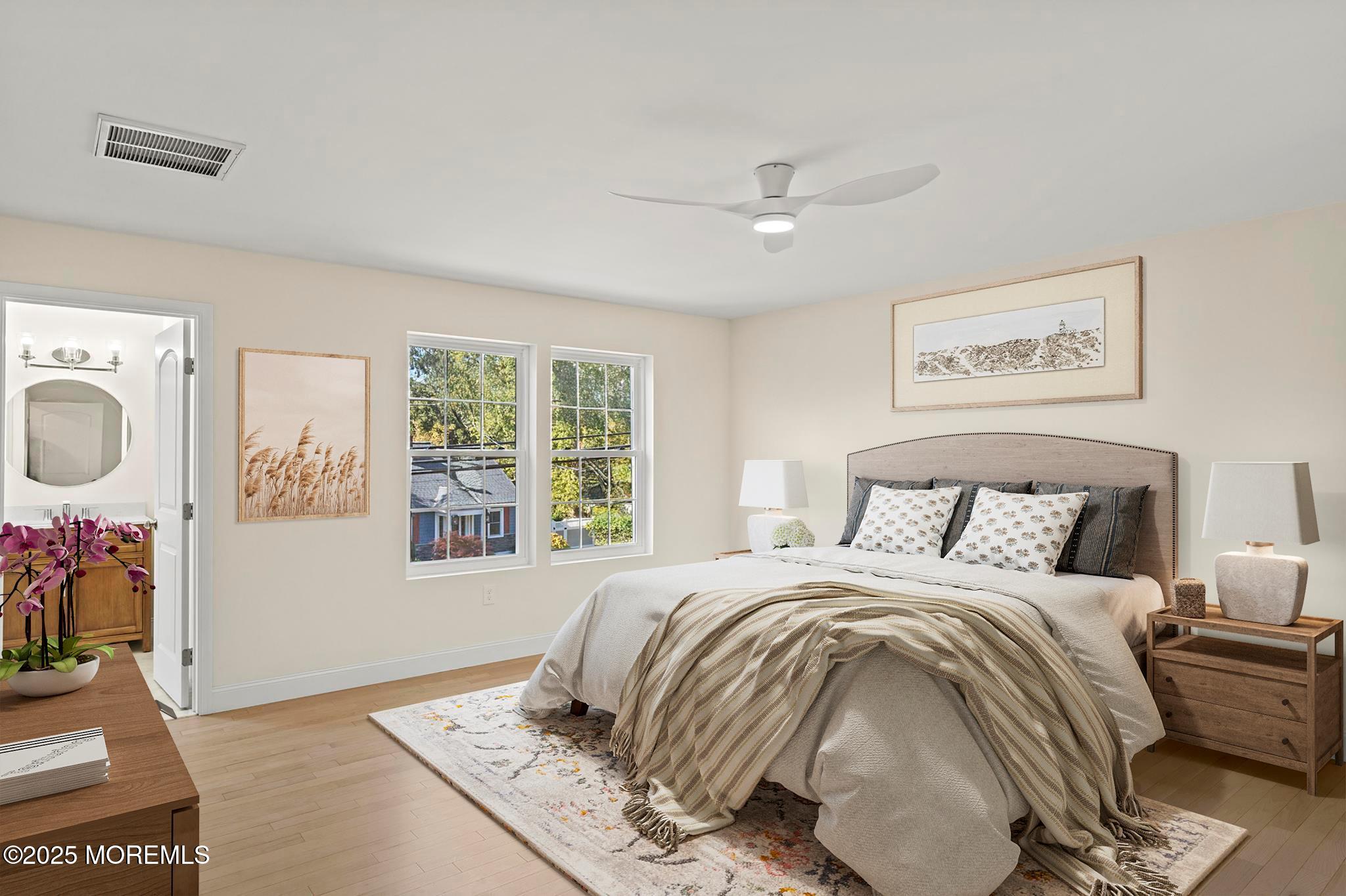 636 Wayside Road Neptune Township, NJ 07753 - Photo 9 of 26 a bedroom with a bed and a window