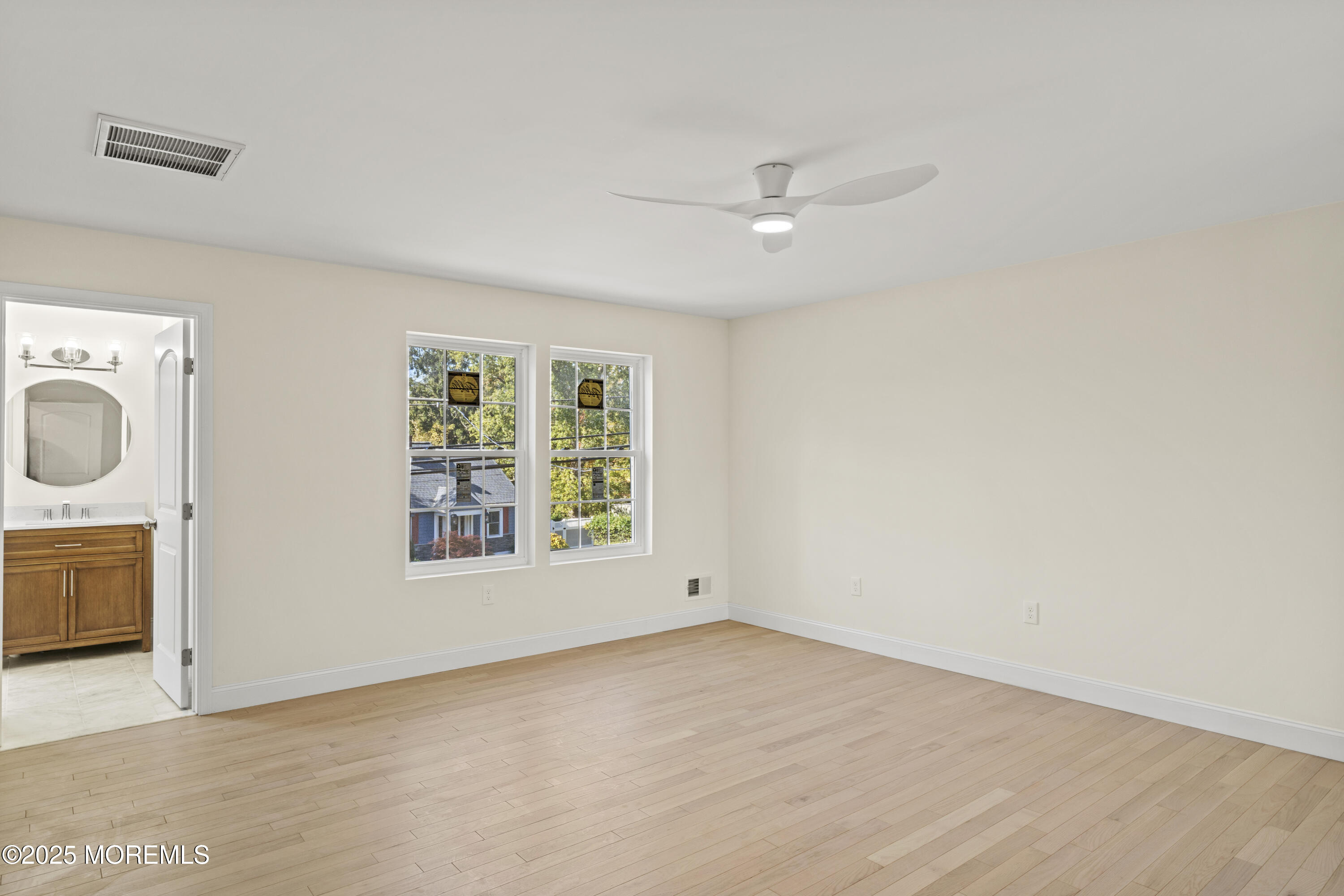 636 Wayside Road Neptune Township, NJ 07753 - Photo 10 of 26 wooden floor in an empty room with a window