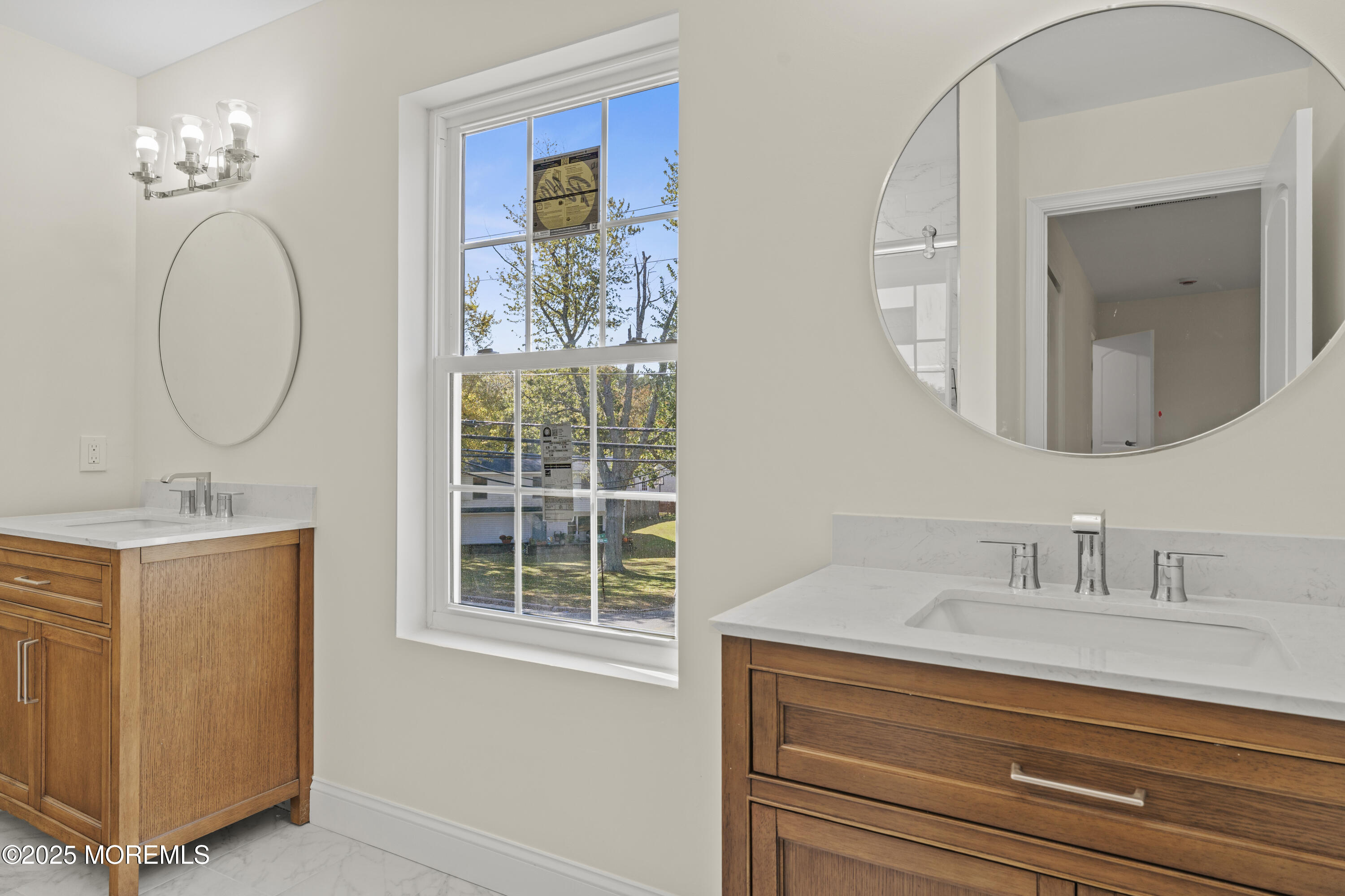 636 Wayside Road Neptune Township, NJ 07753 - Photo 13 of 26 a bathroom with a sink a mirror a vanity and a window