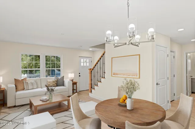 a living room with furniture a window and dining table