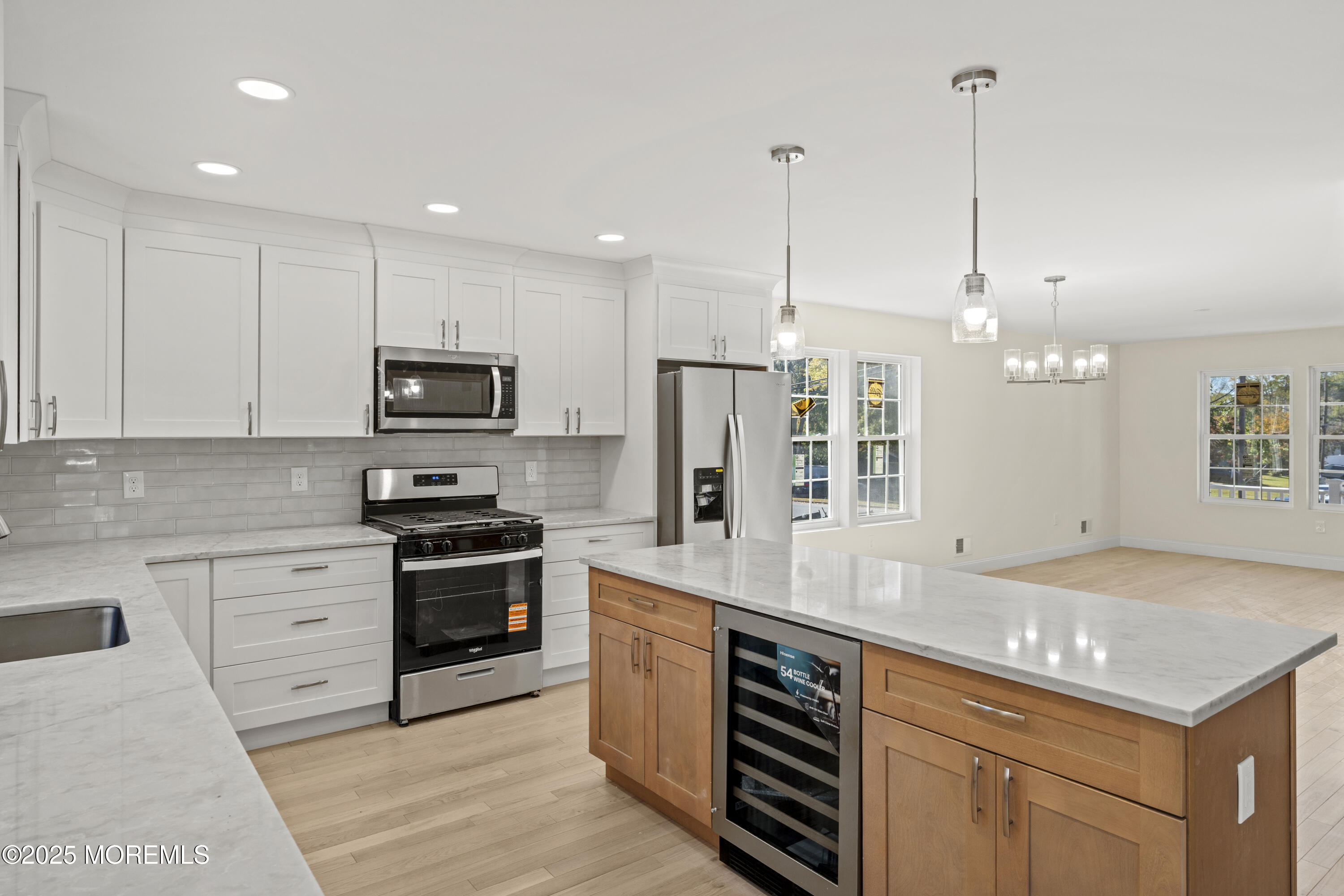 636 Wayside Road Neptune Township, NJ 07753 - Photo 5 of 26 a kitchen with stainless steel appliances granite countertop a sink a stove and a wooden floors