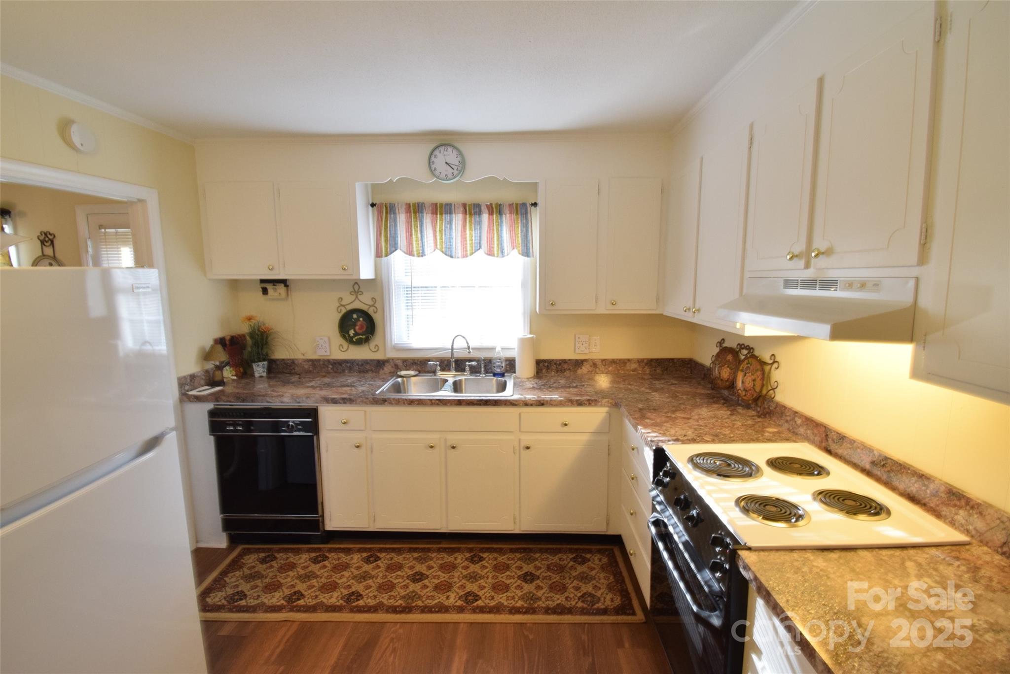 623 South New Hope Road, Unit 13 Gastonia, NC 28054 - Photo 13 of 30 a kitchen with a stove a sink and a refrigerator