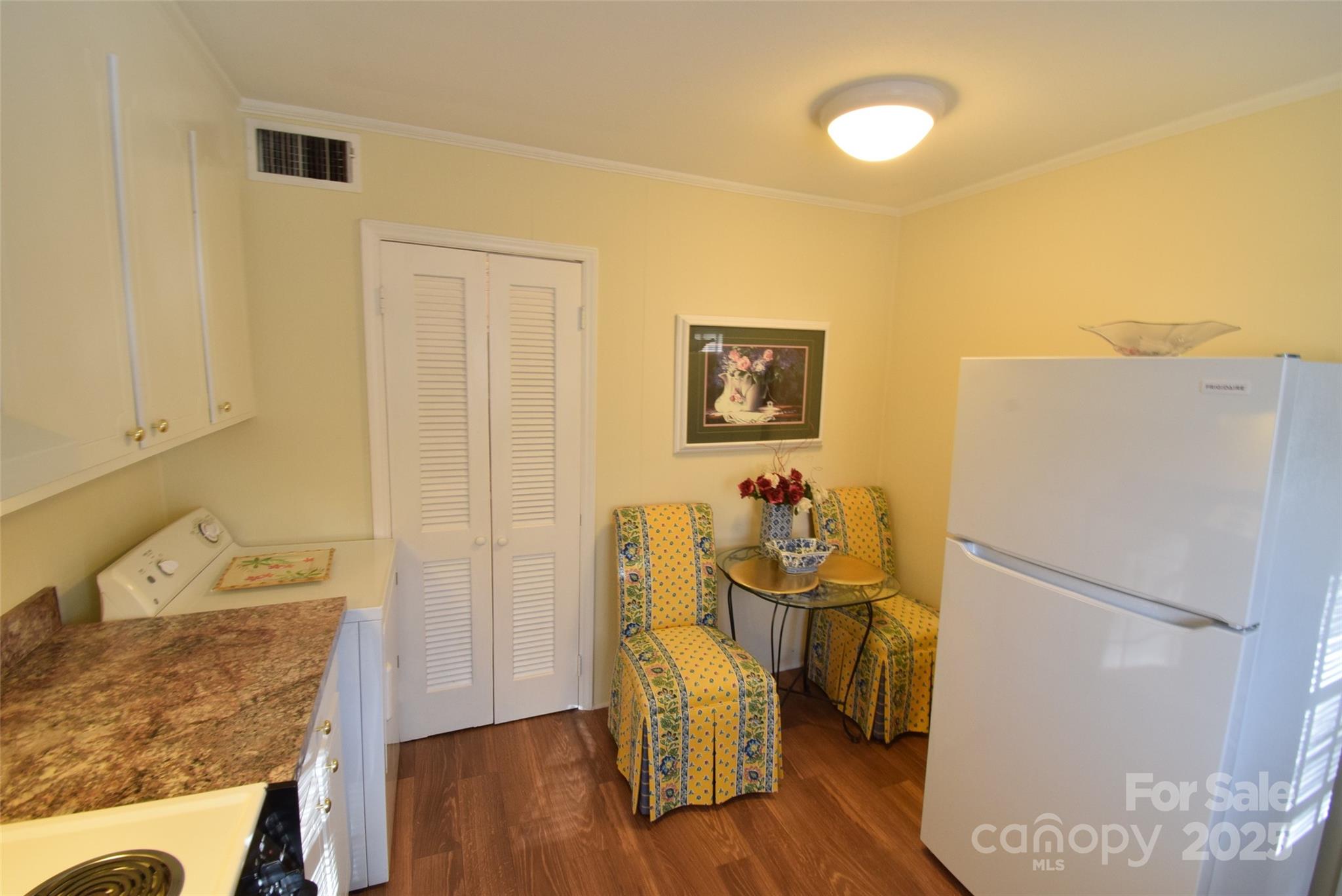 623 South New Hope Road, Unit 13 Gastonia, NC 28054 - Photo 15 of 30 a view of a kitchen with fridge and wooden floor