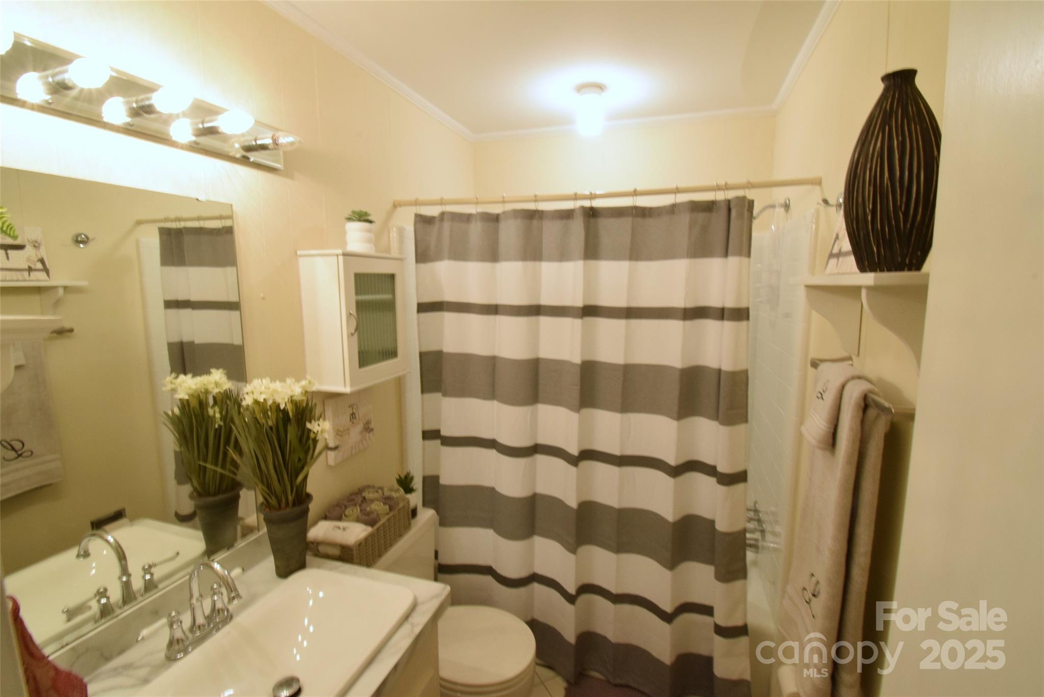 623 South New Hope Road, Unit 13 Gastonia, NC 28054 - Photo 23 of 30 a bathroom with a sink toilet and shower