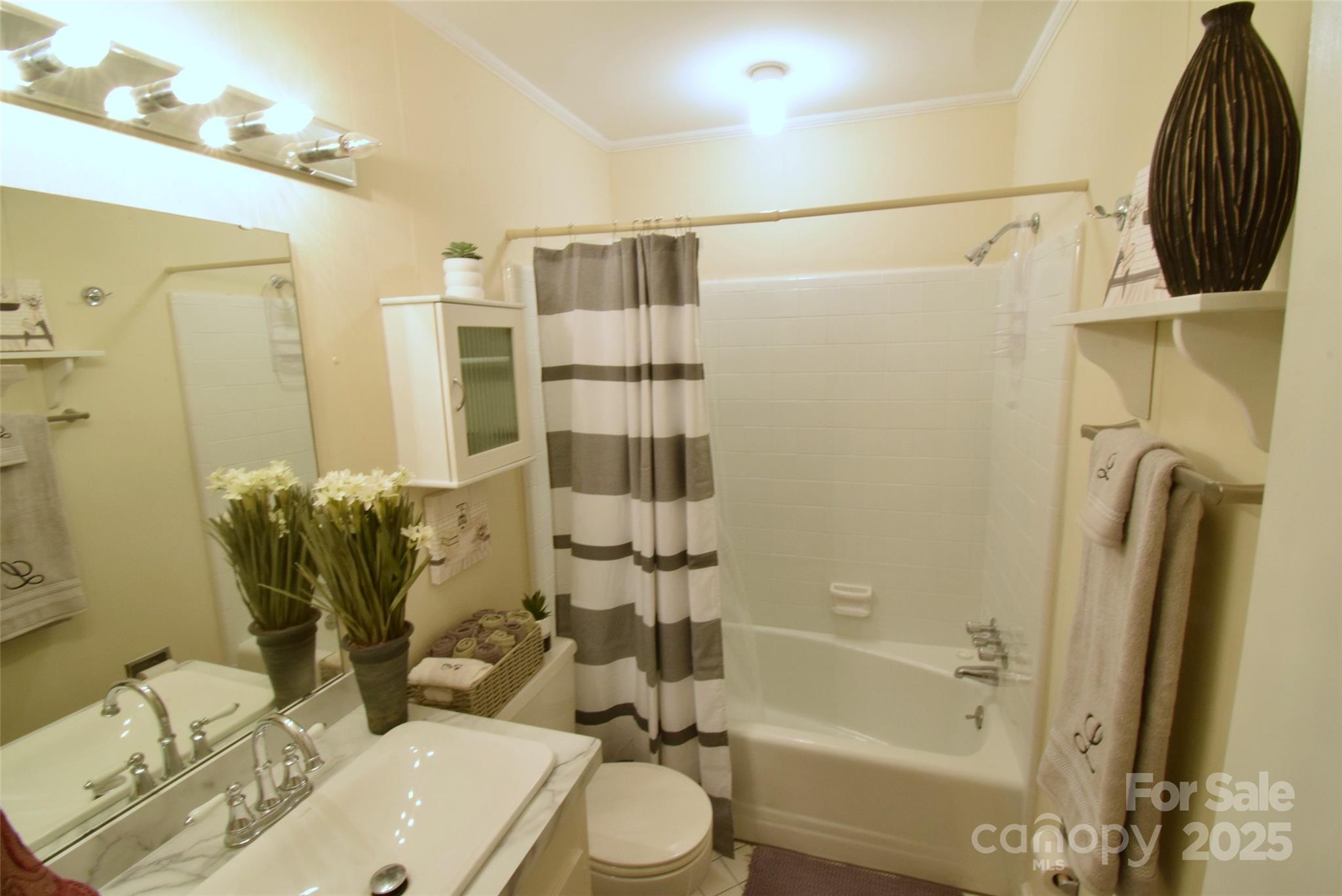 623 South New Hope Road, Unit 13 Gastonia, NC 28054 - Photo 24 of 30 a bathroom with a sink toilet and shower