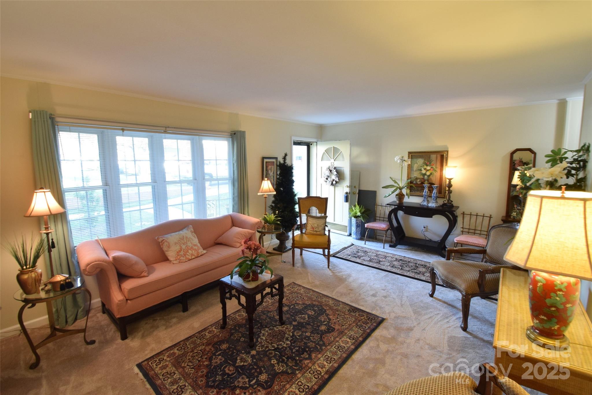 623 South New Hope Road, Unit 13 Gastonia, NC 28054 - Photo 5 of 30 a living room with furniture a rug and a large window