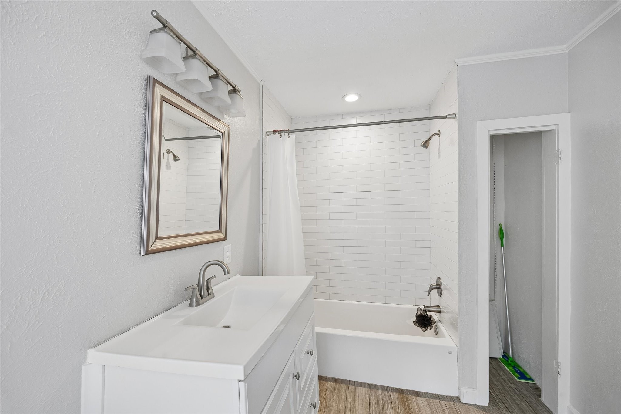 1307 Marshall Street Houston, TX 77006 - Photo 17 of 23 a bathroom with a tub sink and mirror