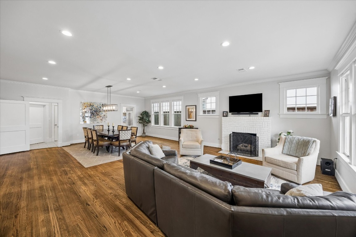 1307 Marshall Street Houston, TX 77006 - Photo 2 of 23 a living room with furniture and a fireplace