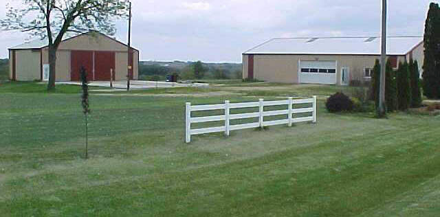 16976 West Lanark Road Forreston, IL 61030 - Photo 4 of 6 a view of a big house with a big yard and large trees