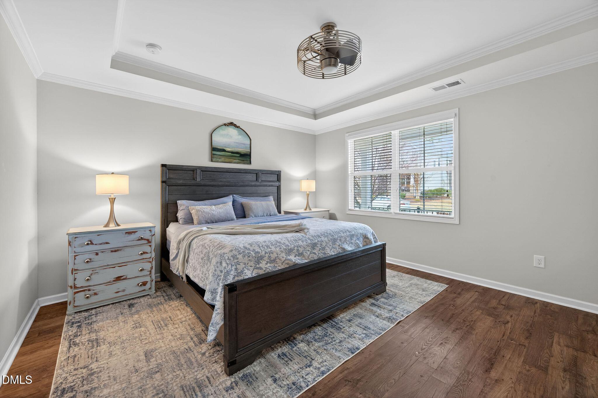 528 Spring Flower Court Cary, NC 27511 - Photo 23 of 51 a bedroom with a bed and a window