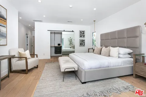 a bed room with a bed and a couch