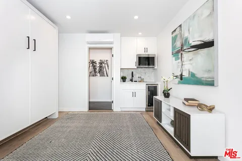 a view of a kitchen with electric appliances