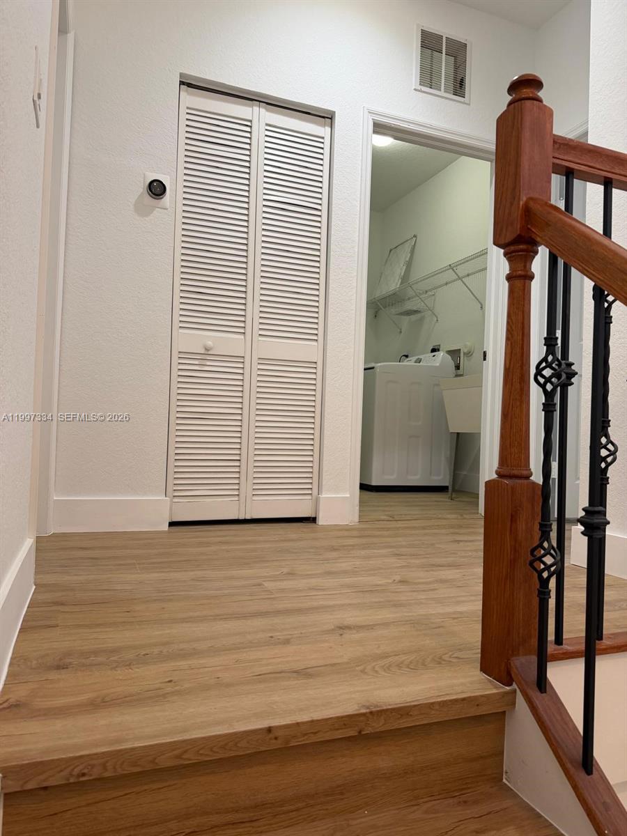 14934 Southwest 41st Lane, Unit 14934 Miami, FL 33185 - Photo 15 of 36 a view of an entryway with wooden floor