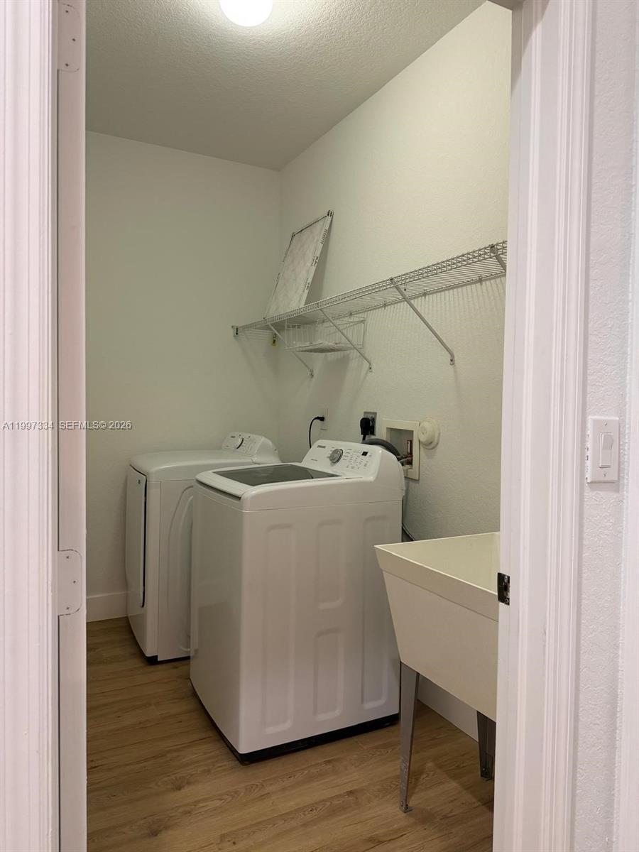 14934 Southwest 41st Lane, Unit 14934 Miami, FL 33185 - Photo 16 of 36 a utility room with dryer and washer