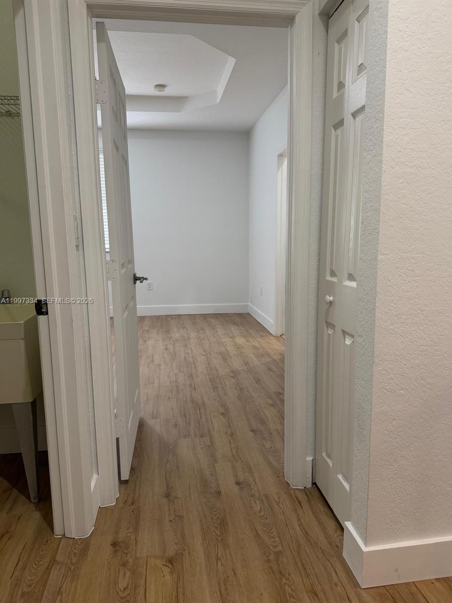 14934 Southwest 41st Lane, Unit 14934 Miami, FL 33185 - Photo 24 of 36 wooden floor in a gallery