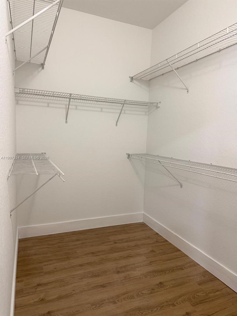 14934 Southwest 41st Lane, Unit 14934 Miami, FL 33185 - Photo 28 of 36 a view of a room with racks on the wall