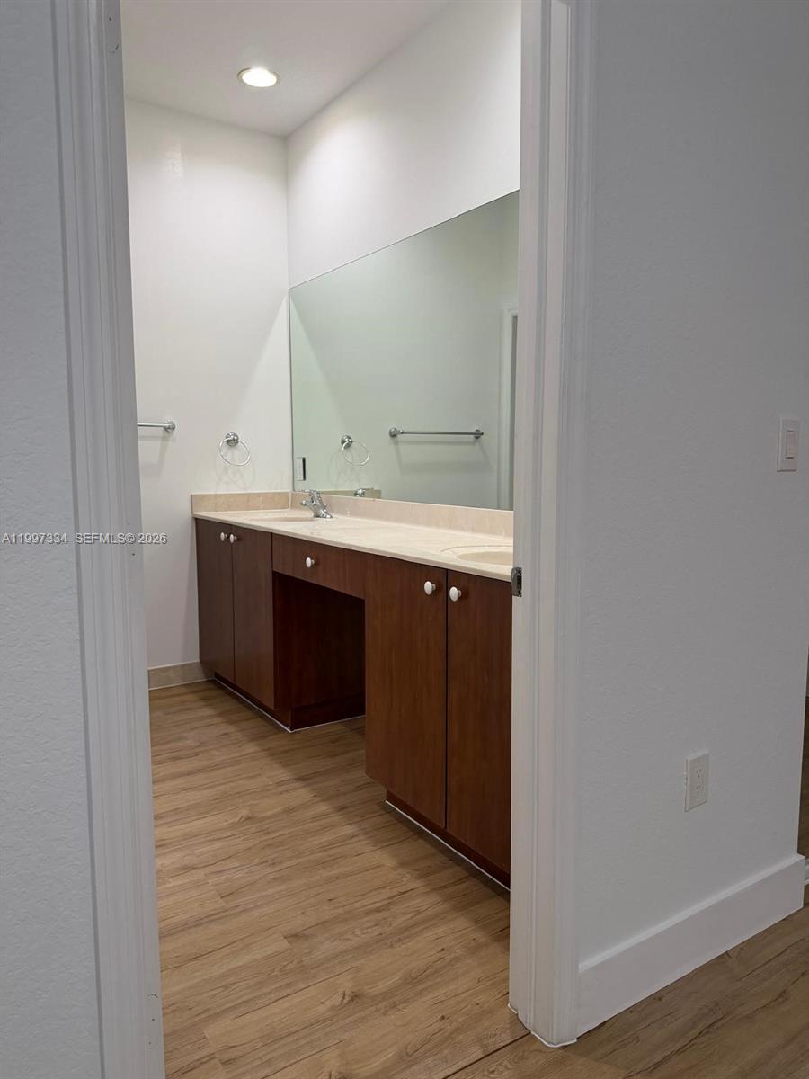 14934 Southwest 41st Lane, Unit 14934 Miami, FL 33185 - Photo 29 of 36 a view of bathroom with a sink and mirror