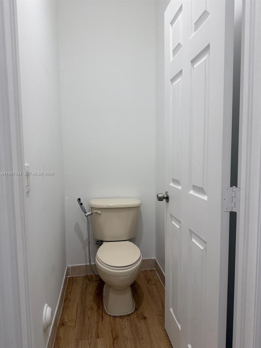 14934 Southwest 41st Lane, Unit 14934 Miami, FL 33185 - Photo 30 of 36 a white toilet sitting next to a shower