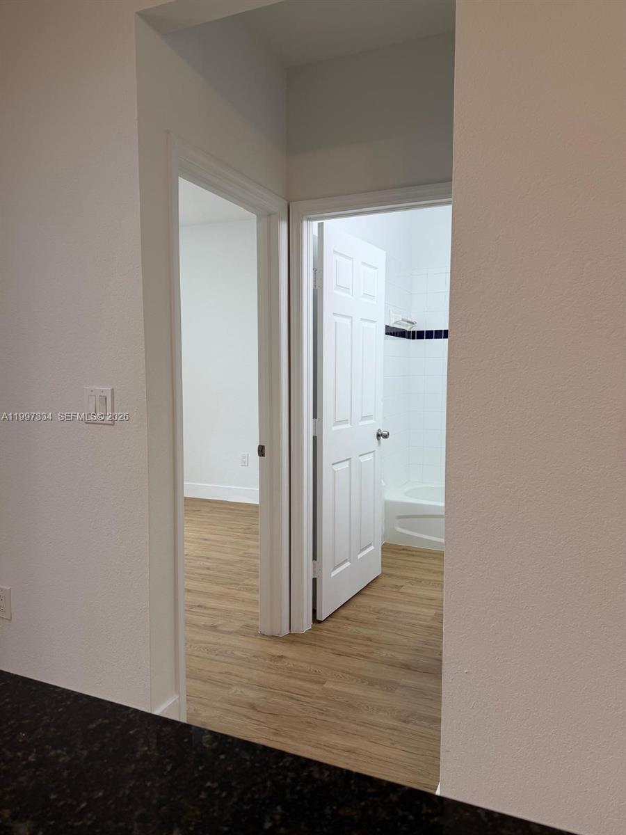 14934 Southwest 41st Lane, Unit 14934 Miami, FL 33185 - Photo 9 of 36 a view of a bathroom with wooden floor