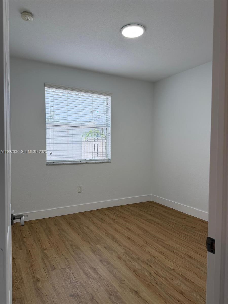 14934 Southwest 41st Lane, Unit 14934 Miami, FL 33185 - Photo 10 of 36 an empty room with a window