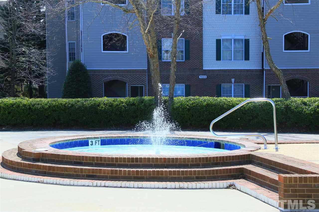 7040 Sandy Forks Road, Unit 201 Raleigh, NC 27615 - Photo 22 of 29 a swimming pool with outdoor space
